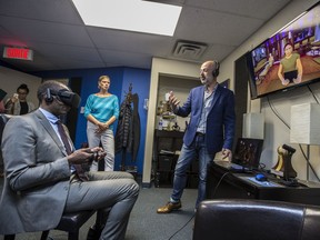 Greg Fergus, MP for Hull-Aylmer, experiences a demonstration of virtual reality therapy as In Virtuo president Stéphane Bouchard conducts the demo at his company offices in Gatineau.