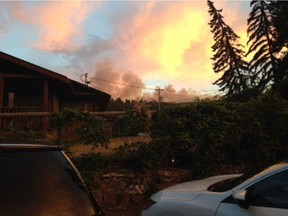 Officials in British Columbia's southern Interior say the forecast warm temperatures and gusting winds could spell the end of two days of relief from wildfires raging in the area. This picture supplied by Summerland resident Susan Johnston, shows the Mount Eneas wildfire from Summerland on July 22, 2018.