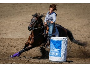Cowgirl Kelly Bruner of Millsap, Texas sailed around the barrels in a time of 17.43 seconds in the barrel racing event at the 2018 Calgary Stampede on Sunday, July 8, 2018. Al Charest/Postmedia