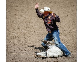 Idaho cowboy Matt Shiozawa posted a time (7.1 seconds) on Day 9 of the tie down roping event during the 2018 Calgary Stampede on Saturday, July 14, 2018. Al Charest/Postmedia