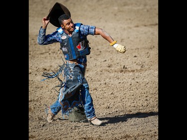 Marcos Gloria of Edmonton, Alberta celebrates after winning the the bull-riding event on Championship Sunday during the 2018 Calgary Stampede on Sunday, July 15, 2018. Al Charest/Postmedia