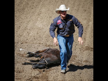 Texas cowboy Tuf Cooper posted a time (6.8 seconds) in the tie-down roping event on Championship Sunday during the 2018 Calgary Stampede on Sunday, July 15, 2018. Al Charest/Postmedia