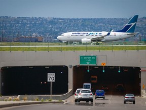 Cars drive under the airport tunnel on Airport Trail in NE Calgary