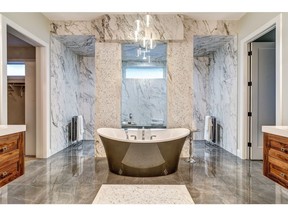 The master ensuite in the Manhattan show home by Astoria Custom Homes in Watermark at Bearspaw.