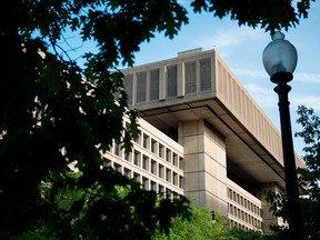 A view of the J. Edgar Hoover Building, the headquarters for the Federal Bureau of Investigation (FBI), is seen in Washington, DC.  The FBI announced on July 2, 2018 the arrest of a professed supporter of Al Qaeda who planned a bomb attack on a July 4 parade in Cleveland Ohio. The Federal Bureau of Investigation said Demetrius Nathaniel Pitts, who also used the name Abdur Raheem Rafeeq, told an undercover agent that he wanted to load up a van or other vehicles with explosives targeting members of the military and their families during the US national day celebrations on Wednesday.