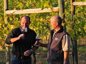 Andy Gebert (left) and his brother Leo enjoy a glass of wine at St. Hubertus & Oak Bay Estate Winery, which they co-own in Kelowna. Andy said business from Albertans has been as strong as ever this summer, after concern across the province about how political tensions would affect the tourism industry this season. (Courtesy Andy Gebert)