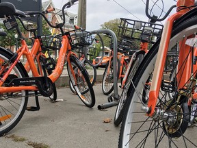 Bikes owned by the bike-share company Dropbike are parked in Kingston, Ont.