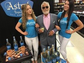 Jonathan Goldsmith flanked by models Joanna Young, L, and Julie Deleemans at Royal Oak Sobeys Liq. store