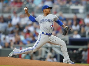 Toronto Blue Jays starting pitcher Marcus Stroman delivers in the first inning of the team's baseball game against the Atlanta Braves, Tuesday, July 10, 2018, in Atlanta. (AP Photo/Todd Kirkland)