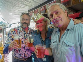Pictured, from left, at the annual Nut Ale fundraiser in support of Calgary's Prostate Cancer Centre are, W. Brett Wilson, Julie Van Rosendaal and Bret "Hitman' Hart. The trio teamed up with Village Brewery to create batches of unique suds with the surprise addition of bull testicles. The fab event, held July 5 at Bottlescrew Bills, raised more than $10,000 for the centre.