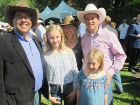 Perfect weather held for the 242nd anniversary of American independence on July 5 at the residence of Tom Palaia, Consul General of the U.S. accredited to Alberta, Saskatchewan and the Northwest Territories. Pictured with the Consul General (right) and Mayor Naheed Nenshi are Palia's wife Sarah and their daughters Margaret (second from left) and Violet.