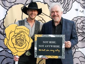Pictured at the Not in My City 2nd annual VIP awareness and fundraising event held at the Deane House June 20 are #NotInMyCity founder Paul Brandt  with Michael Hayward, vice-president, marketing and guest experience at The Calgary Airport Authority. The Calgary Airport Authority announced its full support as an Ally of #NotInMyCity at a press conference held earlier in the day.