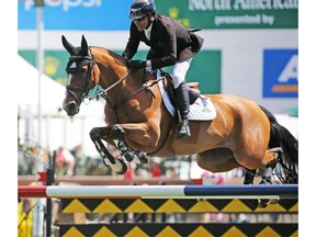 Canada's Eric Lamaze and Fine Lady 5 won the ATCO Queen Elizabeth II Cup at the Spruce Meadows North American show jumping event on Saturday July 7, 2018.  Gavin Young/Postmedia