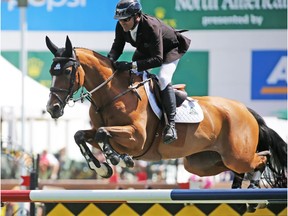 Canada's Eric Lamaze and Fine Lady 5 won the ATCO Queen Elizabeth II Cup at the Spruce Meadows North American show jumping event on Saturday July 7, 2018.  Gavin Young/Postmedia