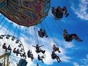 After the heat of the day evening was a great time to take enjoy the rides on the Calgary Stampede Midway, Monday July 9, 2018.  Gavin Young/Postmedia