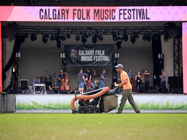 The grass in front of the main stage has a final vacuum of goose droppings before the start of the Calgary Folk Festival on Prince's Island on Thursday July 26, 2018.