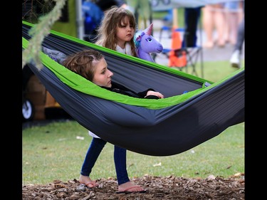 The Calgary Folk Festival - where you can find both hammocks and unicorns under the trees. Fans hang out on opening night, Thursday July 26, 2018.