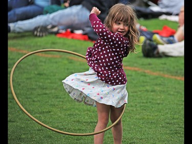 Romy Benoit, 4, perfects her hula hooping skills  at the Calgary Folk Festival on opening night, Thursday July 26, 2018.