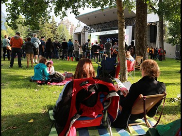 The evening sun warms up Calgary Folk Festival goers after a showery opening night, Thursday July 26, 2018.