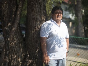 Carlos Zuniga, 52, a doctor who fled El Salvador with his wife and two sons, is pictured at the FCJ Refugee Centre in Toronto on Tuesday July 10, 2018.