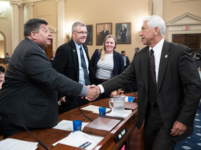 Rep. Dave Reichert, R-Wash., right, chairman of the House Subcommittee on Trade, shakes hands with witnesses who testified about the effect of foreign tariffs on American agriculture on July 18, 2018.