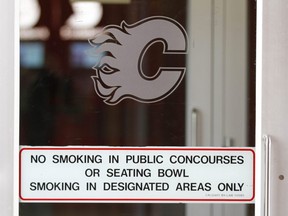 A sign is shown on an exterior door at the Scotiabank Saddledome in Calgary on Tuesday, July 3, 2018.