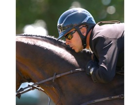 Eric Lamaze (CAN) rides Chesney to the win in a jump-off in the ATCO Cup at the Spruce Meadows North American in Calgary, AB on Thursday, July 5, 2018. Jim Wells/Postmedia