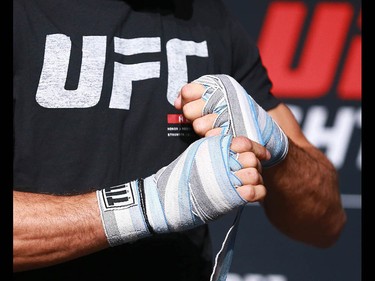 Jose Aldo tapes his hands before he works out at the Palace Theatre in Calgary on Wednesday, July 25, 2018. The preparations have begun for UFC Fight Night which will take place Saturday July 28.  Jim Wells/Postmedia