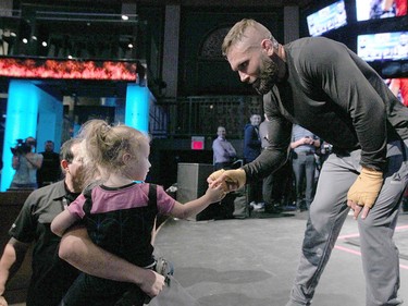 Kira Bull (2 yrs) and mom Haylee Bull meets Jeremy Stephens during work outs at the Palace Theatre in Calgary on Wednesday, July 25, 2018. The preparations have begun for UFC Fight Night which will take place Saturday July 28.  Jim Wells/Postmedia