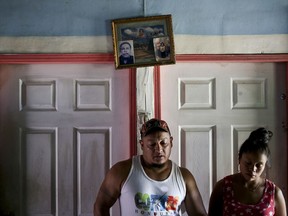 In this July 18, 2018 photo, Rolando Bueso Castillo and his wife Adalicia Montecinos, stand in their home in La Libertad, Honduras. It's been five months since they have seen their infant son Johan Bueso Castillo who was separated from Bueso Castillo at the Texas border in March and sent to a shelter in Arizona.