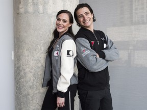 Ice dancing pair Tessa Virtue, left, and Scott Moir pose for a photo at the Entertainment One office in Toronto, Tuesday, July, 10, 2018. They will be visiting 30 Canadian cities in the fall as part of the Thank You Canada Tour. THE CANADIAN PRESS/Marta Iwanek ORG XMIT: MAI102