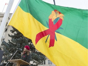 Kristin Dunn, peer support worker for AIDS Saskatoon, speaks at the raising of a provincial HIV flag at the Legislative Building. MICHAEL BELL / REGINA LEADER-POST