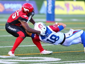 The Calgary Stampeders' Ja'Gared Davis sacks Montreal Alouettes quarterback Matthew Shiltz in CFL action at McMahon Stadium in Calgary on Saturday July 21, 2018. Calgary won the game 25-8 Gavin Young/Postmedia