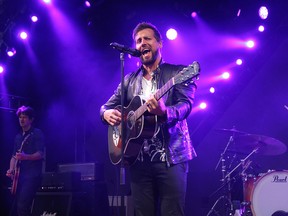 Raine Maida, lead vocalist of the Canadian rock band Our Lady Peace, performs on the Stampede Coke stage on Tuesday, July 10, 2018. Dean Pilling/Postmedia