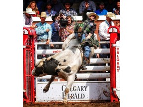 J.B. Mauney from Statesville, N.C., during bull riding at the Calgary Stampede in Calgary, on Tuesday July 10, 2018. Leah Hennel/Postmedia