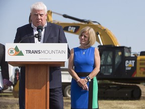 Kinder Morgan Canada president Ian Anderson and Alberta Premier Rachel Notley speak during a ground-breaking ceremony at the Trans Mountain stockpile site in Edmonton on Friday July 27, 2018.