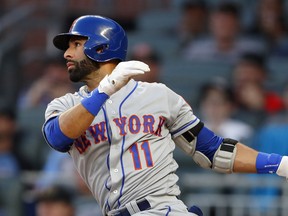 Jose Bautista drives in a run with a double in the first inning of the Mets' May 29 game against Atlanta.