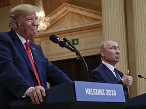 Russian President Vladimir Putin, right, and U.S. President Donald Trump give a joint news conference at the Presidential Palace in Helsinki, Finland, on Monday, July 16, 2018.