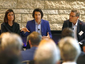 L-R, Hannah Burns, Head of Promotion, Olympic Games and Olympic Candidatures, IOC, Christophe Dubi, Olympic Games Executive Director, IOC, and Scott Hutcheson, Chair, Calgary 2026 Board of Directors speak at a panel hosted by the Calgary Chamber of Commerce in on Tuesday July 24, 2018.