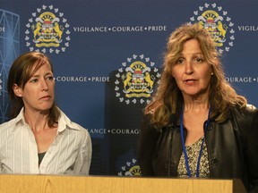 Danielle Aubry of Calgary Communities Against Sexual Assault (CCASA) speaks to media as Sunny Marriner of the Ottawa Rape Crisis Centre, looks on at a press conference announcing they will be  reviewing case files closed as unfounded or cleared otherwise.Thursday, July 12, 2018. Dean Pilling/Postmedia