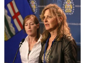 Danielle Aubry of Calgary Communities Against Sexual Abuse (CCASA) speaks to media as Sunny Marriner of the Ottawa Rape Crisis Centre looks on at a press conference announcing they will be  reviewing case files closed as unfounded or cleared otherwise, on Thursday, July 12, 2018.