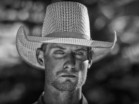 Bronc rider Johnathan Klein poses for a portrait before competing at the Nanton Nite Rodeo on Saturday June 30, 2018.