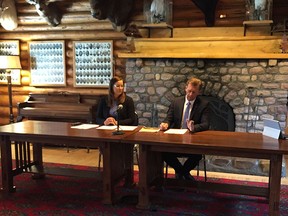 Angela Pitt and Mike Ellis speak at a news conference in Calgary Wednesday.