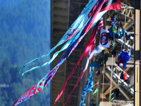 A dozen anti-pipeline protesters are beginning the second day of their tanker blockade by being suspended from the Ironworkers Bridge, while other supporters prepare for a rally.