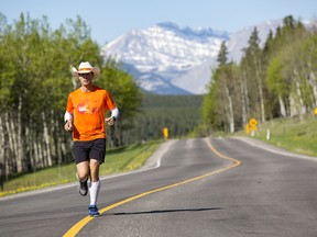 Dave Proctor, running through Alberta during his Outrun Rare Tour. The ultra-marathoner is now approaching Winnipeg, 2,300 km into his cross-Canada run.