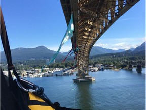 Seven climbers from Greenpeace Canada suspended themselves from the Ironworkers Memorial Bridge in Vancouver on Tuesday, July 3, 2018 in what they called a blockade to impede pil-tanker traffic as an act of peaceful resistance to the Trans Mountasin pipeline expansion to Burnaby, B.C. from Alberta. Five other Greenpeace members were on the bridge to support the climbers.
credit: Mike Hudema, Greenpeace Canada