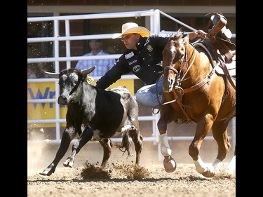 Matt Reeves from Cross Plains,TX, wins the Steer Wrestling Championships on day 10 of the 2018 Calgary Stampede rodeo on Sunday July 15, 2018. Darren Makowichuk/Postmedia