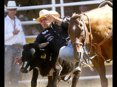 Matt Reeves from Cross Plains,TX, wins the Steer Wrestling Championships on day 10 of the 2018 Calgary Stampede rodeo on Sunday July 15, 2018. Darren Makowichuk/Postmedia