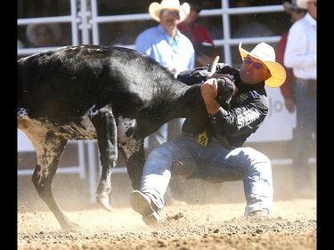 Matt Reeves from Cross Plains,TX, wins the Steer Wrestling Championships on day 10 of the 2018 Calgary Stampede rodeo on Sunday July 15, 2018. Darren Makowichuk/Postmedia