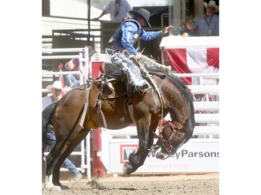 Ryder Wright from Milford,UT, wins the Saddle Bronc Championships on day 10 of the 2018 Calgary Stampede rodeo on Sunday July 15, 2018. Darren Makowichuk/Postmedia